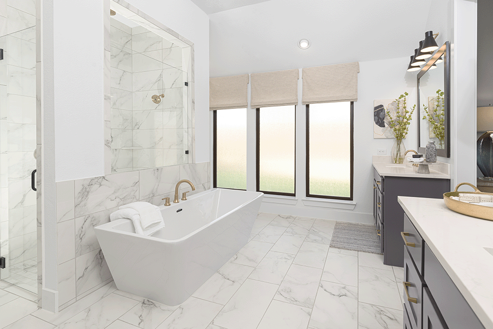 Primary bathroom with garden tub and wall of windows