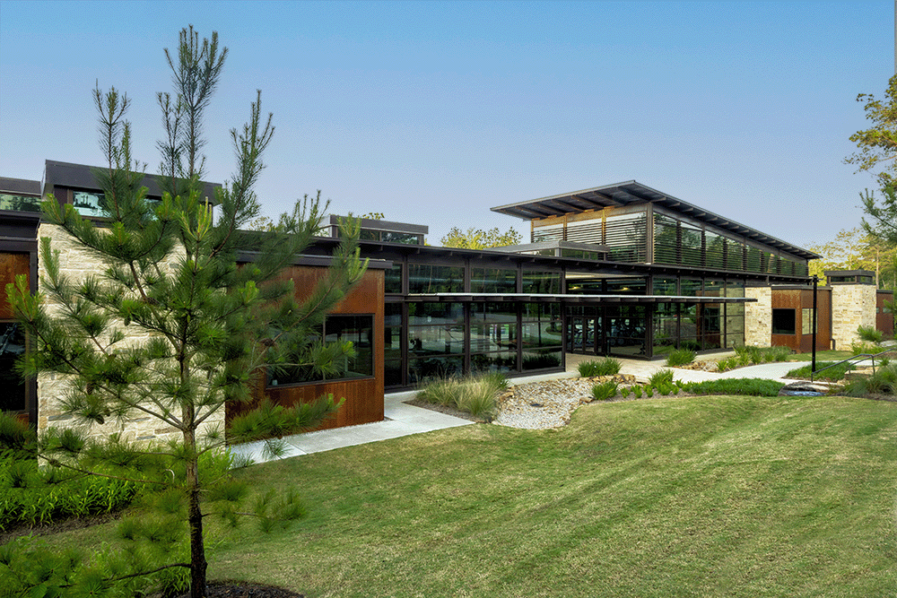 all glass community center with a fitness center